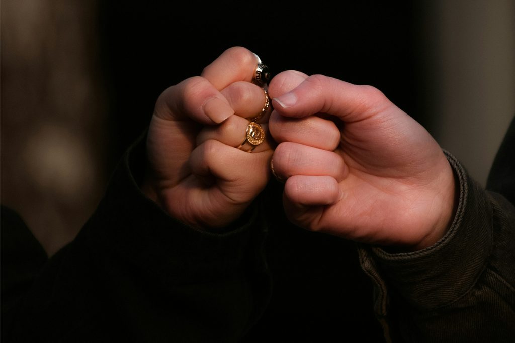 two people fist bumping